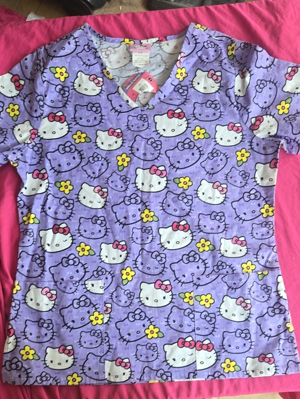 Sanrio Hello Kitty Lavender V-Neck Scrub Top with Pink Bows and Yellow Flowers